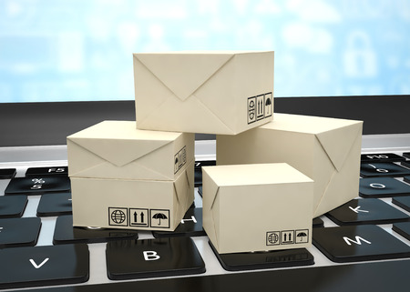Technology business concept, shipping: cardboard package boxes on laptopの写真素材