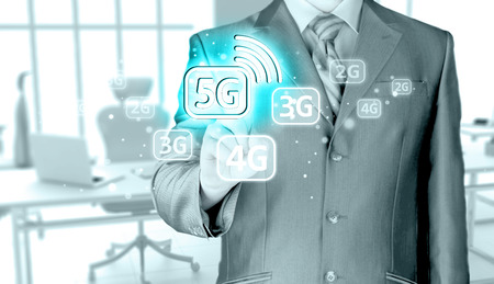 businessman holding in hand 5G, technology backgroundの写真素材