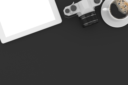 camera and coffee on workplace table, top viewの写真素材