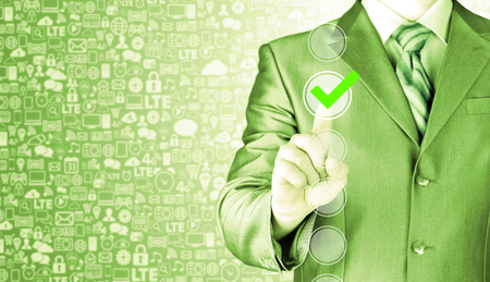 business man touching, pressing modern button with green ticking Check Box.の写真素材