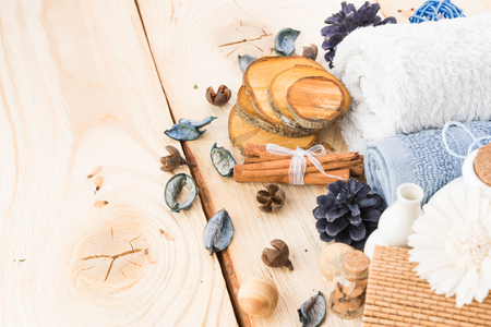 spa stuff, cinnamonand flower with towel on woodの写真素材