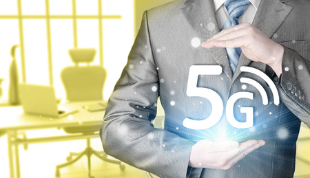 businessman holding in hand 5G, technology backgroundの写真素材