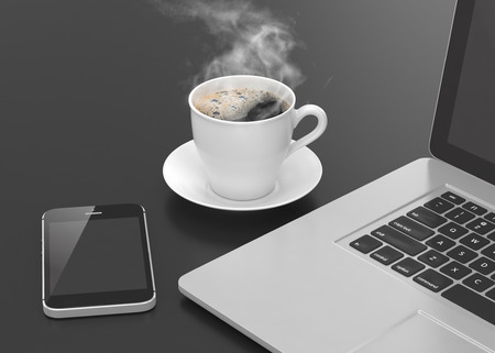 Laptop smartphone and coffee cup on blackの写真素材