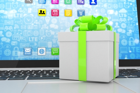 Gift box with ribbon on laptop keyboardの写真素材