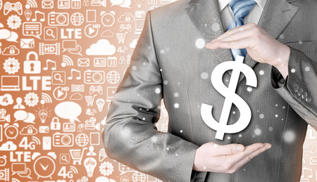 businessman protecting dollar symbolの写真素材