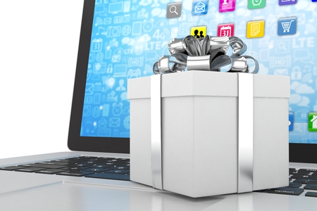 Gift box with ribbon on laptop keyboardの写真素材