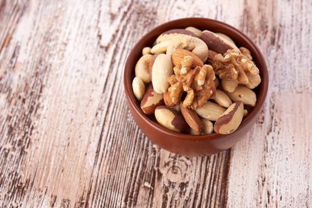 Mix nuts  on wooden backgroundの写真素材