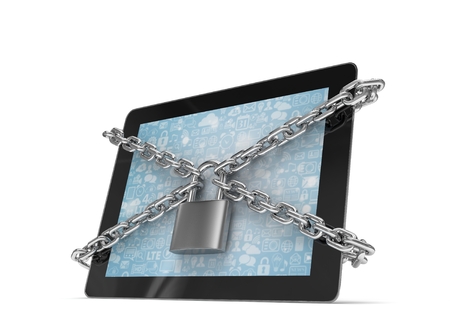tablet PC with chains and lock isolated on white backgroundの写真素材