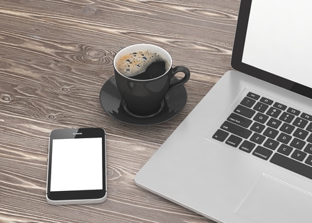 Laptop smartphone and coffee cup on woodの写真素材