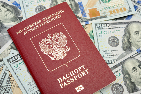 Russian passport with American dollarsの写真素材