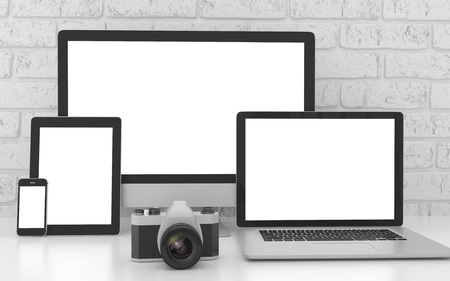 Responsive mockup screen. Monitor, laptop, tablet, phone on table in office.の写真素材