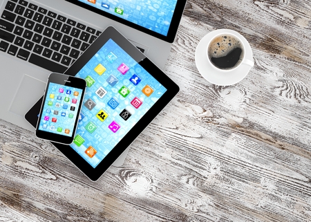 Laptop, phone, tablet pc and coffee. 3d rendering.の写真素材
