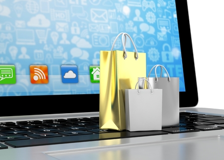 laptop and shopping bags on white background. 3d rendering.の写真素材