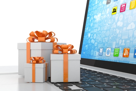 Gift box with ribbon bow on laptop keyboard. 3d rendering.の写真素材