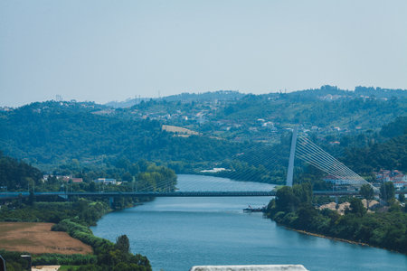 cable bridge through the river Mondego, Coimbra, Portugalの写真素材