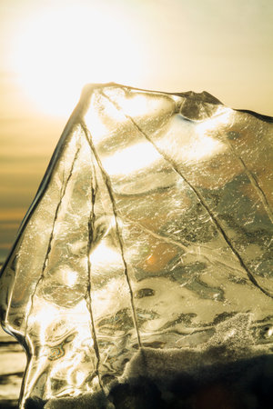 an ice floe on the Baikal lake in winter during sunsetの写真素材