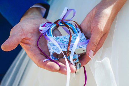 newlyweds keep a symbolic decorated lockの写真素材