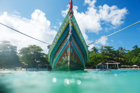 traditional thai boat on an anchor in a bay of the Koh Racha Yai island in Thailand at the Phuketの写真素材