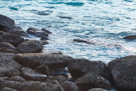 water at the coast rocks on an island