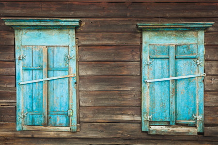 windows of a wooden house in springの写真素材