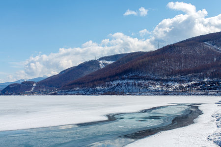 a thawed patch on the Baikal lake shore in spring