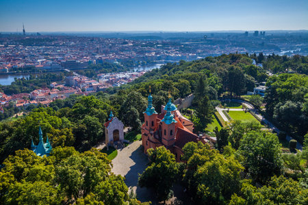 A panoramic view from a high vantage point, showcasing a sprawling city with a large complex of...