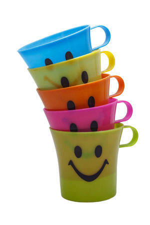Smile plastic cups, isolated on white .の写真素材