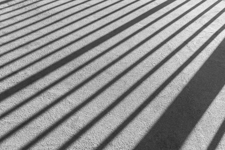 shadow of fence on footpath. Black and Whiteの写真素材