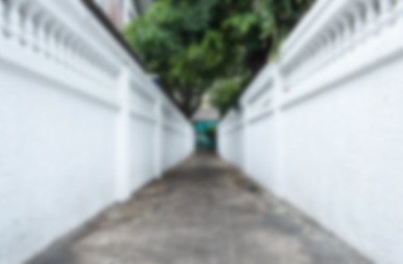 Blurred way with white walls.の写真素材