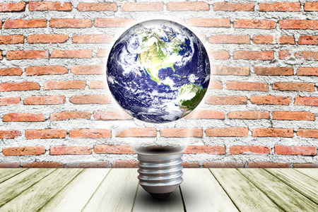 Planet in lighting bulbの写真素材