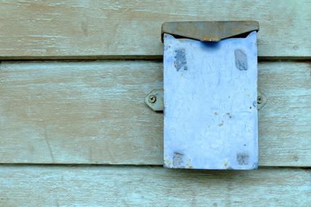 Old Metal Box on Wood Wall Background.の写真素材