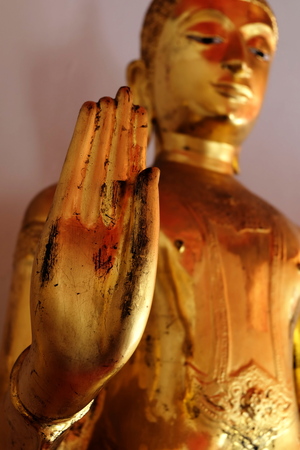 Hand of Ancient Golden Buddha Image. (Selective Focus)の写真素材