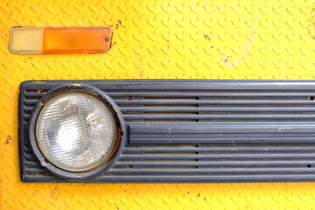 Close up Headlight of Old Yellow Truck Car.