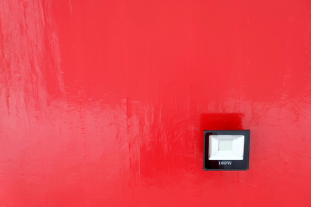 Spotlight on Red Ceiling Background.