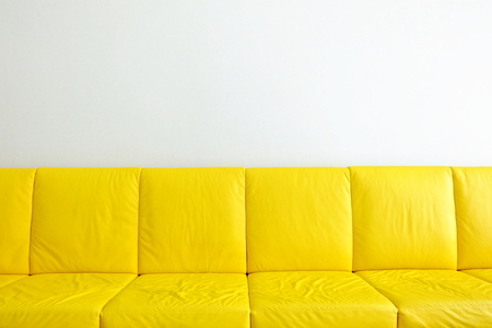 Yellow Sofas with White Wall Background.の写真素材