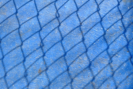 Shadow Fence on Blue Ground.の写真素材