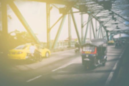 Blurred Tuk Tuk Taxi on Memorial Bridge, Bangkok Thailand.の写真素材