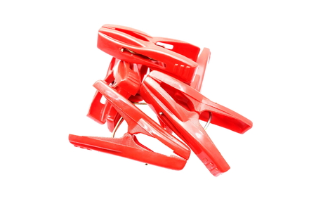 Red Plastic Cloth Clamps Isolated on White Background.の写真素材