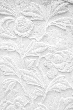 Vintage Thai Sculpture on Stone Wall.の写真素材