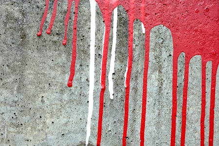 Stain White and Red Paint on Concrete Wall.の写真素材