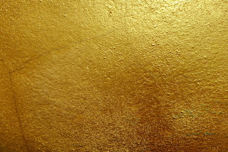 Dark Golden Paint on Stone Background.の写真素材