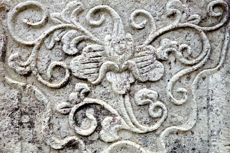 Vintage Thai Sculpture on Stone Wall.の写真素材