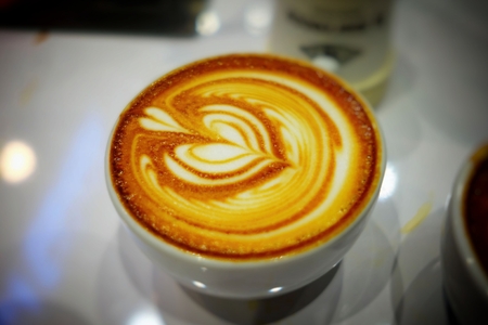 Closed-up Latte Coffee in White Cup. (Selective Focus)の写真素材