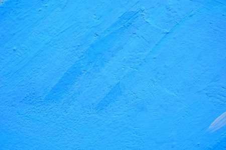 Blue Painting on Concrete Wall Background.の写真素材
