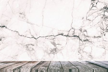 Empty Wooden Table with White Marble Wall Background, Suitable for Presentation, Web Temple, Backdrop, and Product Display.の写真素材