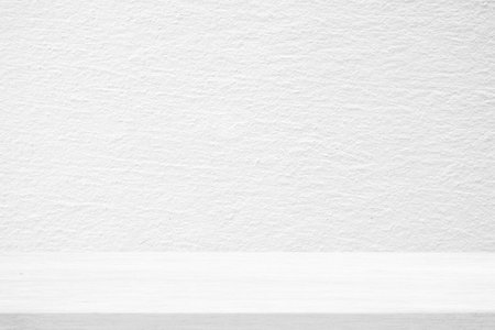 Wood Table with White Stucco Wall Texture Background, Suitable for Product Presentation Backdrop, Display, and Mock up.の写真素材