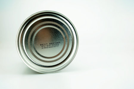 Best Before Date under Food Can on White Studio Background.の写真素材