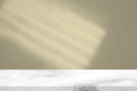White Marble Table with Beige Stucco Wall Texture Background, Suitable for Product Presentation Backdrop, Display, and Mock up.の写真素材