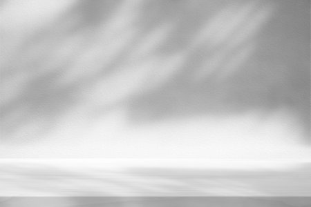 White Wood Table with Tree Shadow on Concrete Wall Texture Background, Suitable for Product Presentation Backdrop, Display, and Mock up.の写真素材