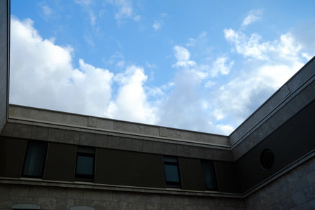 Scenery of White Cloud and Blue Sky from Window of Vintage Building.の写真素材
